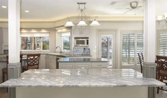 a utility room with cabinets washer and dryer