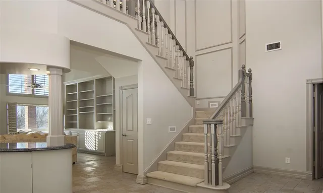 a bathroom with a double vanity sink mirror and bathtub