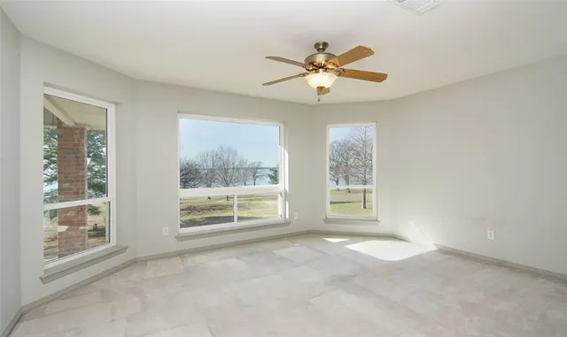 a view of a street with wooden fence