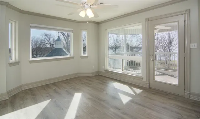wooden floor in a room with a bathroom