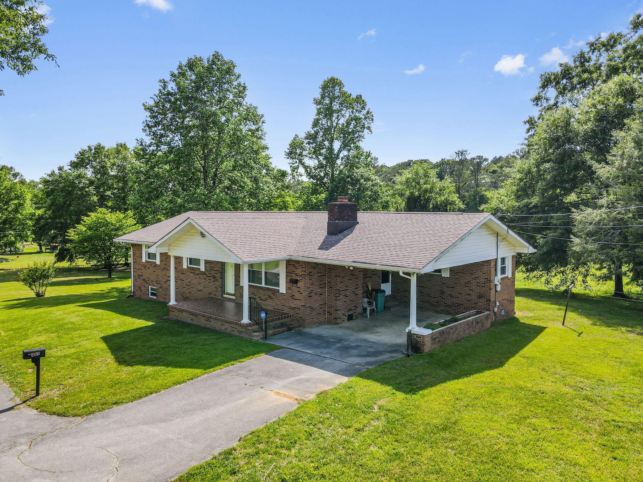 415 Parksville Road Benton, TN 37307 - Photo 29 of 34 a view of a house with a yard porch and sitting area