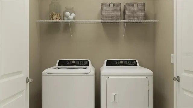 a utility room with dryer and washer