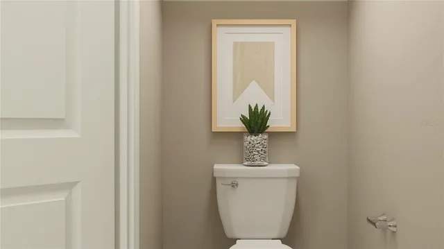 a bathroom with a toilet and a sink