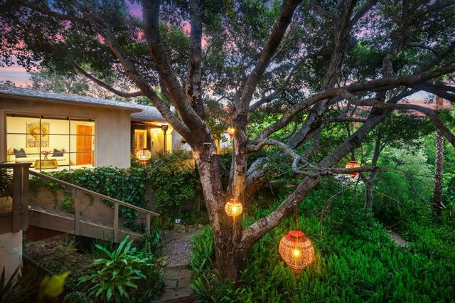 a backyard of a house with lots of green space