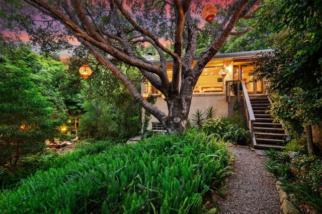 a backyard of a house with lots of green space