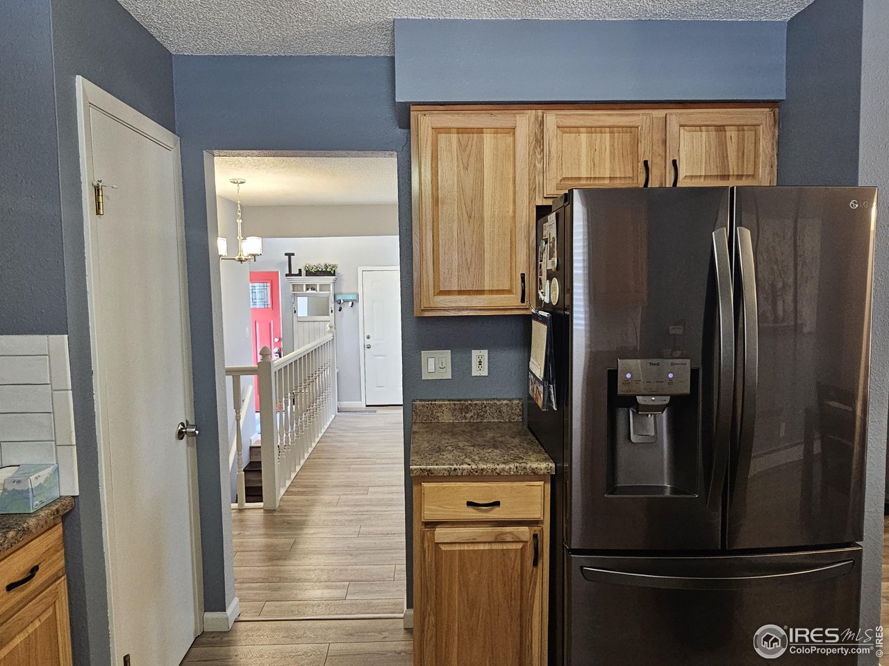 1628 Pheasant Ridge Sterling, CO 80751 - Photo 12 of 40 South wall of kitchen. Closed door is the pantry.