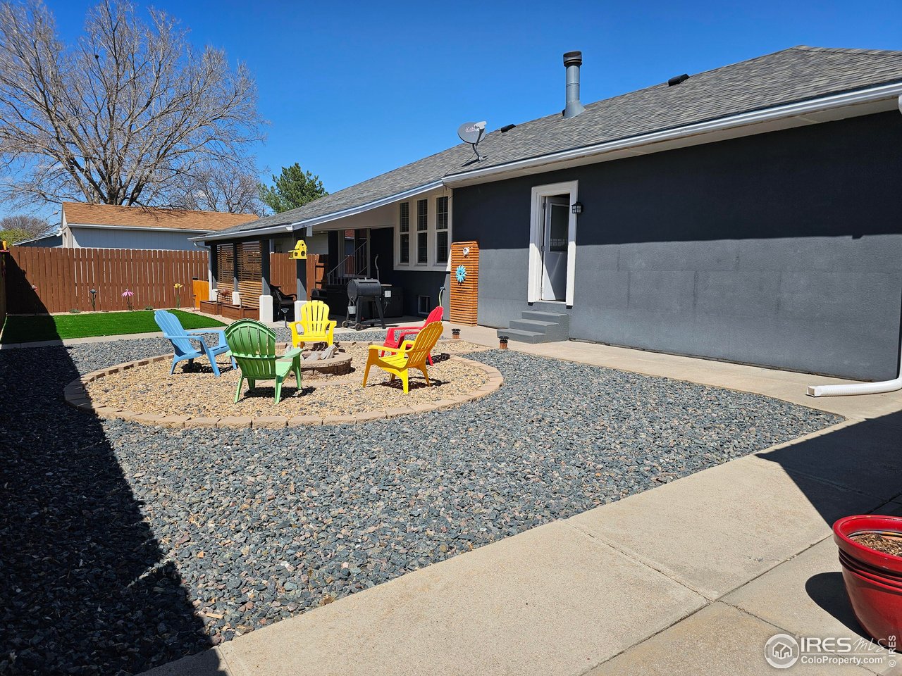 1628 Pheasant Ridge Sterling, CO 80751 - Photo 29 of 40 Xeriscaped backyard complete with firepit and artificial turf