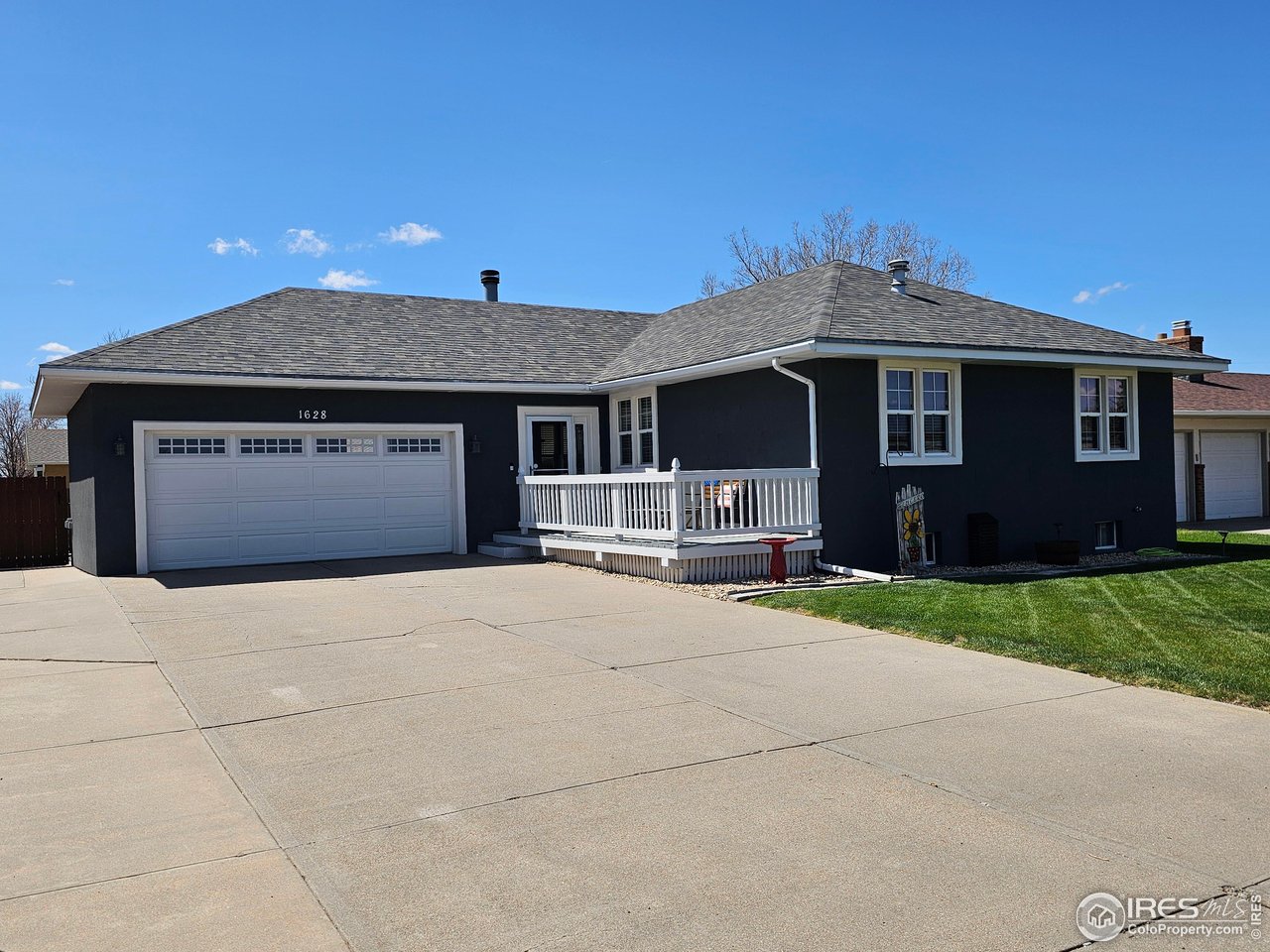 1628 Pheasant Ridge Sterling, CO 80751 - Photo 3 of 40 Oversized drive with RV parking on the south side of the home that includes electricity for your RV