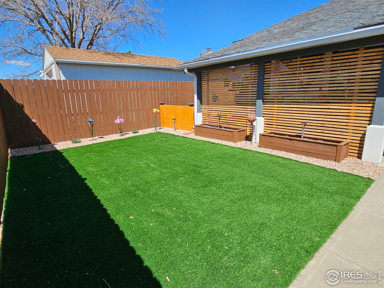 1628 Pheasant Ridge Sterling, CO 80751 - Photo 33 of 40 Artificial turf in backyard.