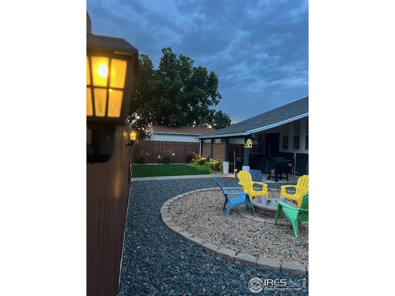 1628 Pheasant Ridge Sterling, CO 80751 - Photo 37 of 40 Lights located on the alley fence provide a nice touch. (photo provided by sellers)