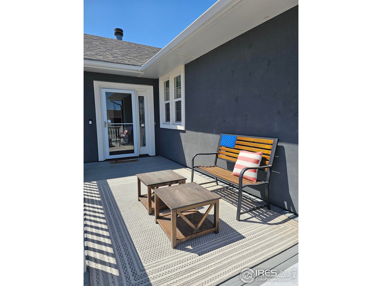 1628 Pheasant Ridge Sterling, CO 80751 - Photo 4 of 40 Enjoy mornings on your spacious front deck