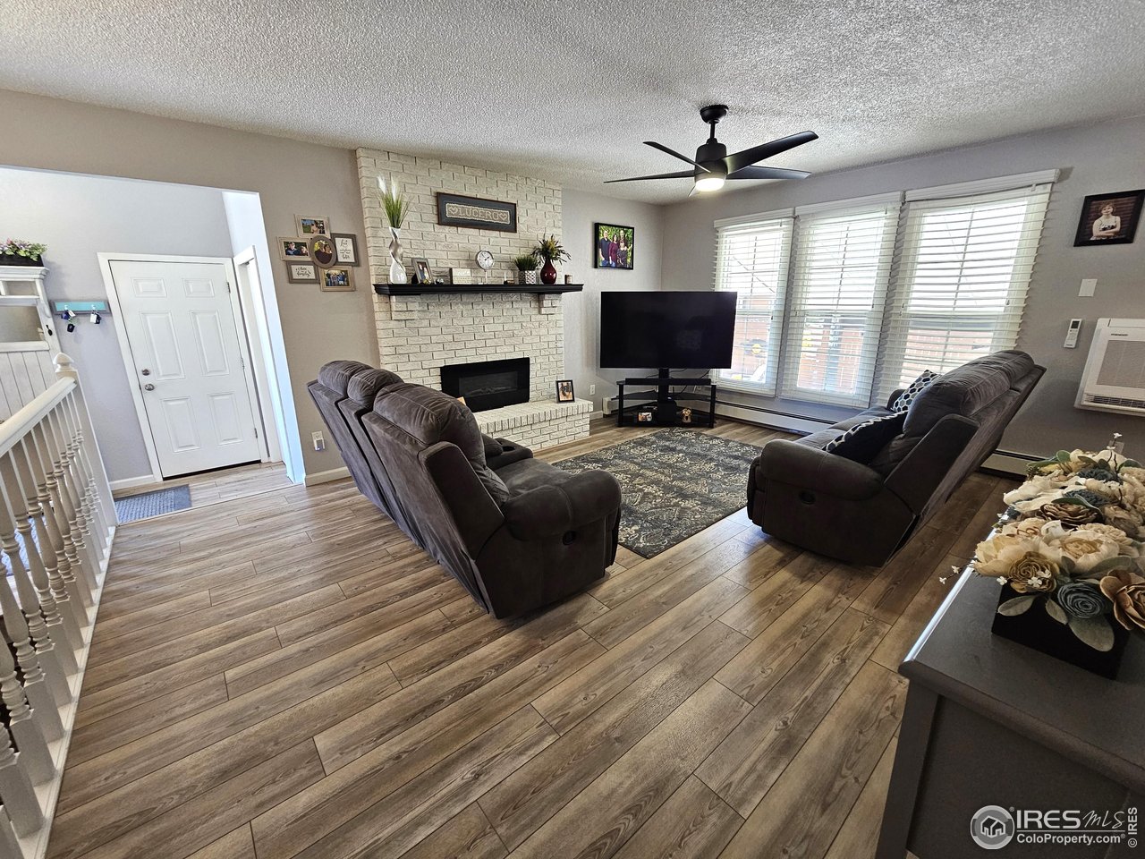 1628 Pheasant Ridge Sterling, CO 80751 - Photo 8 of 40 Living room is 14 x 13 measured from the cabinet to the west wall of windows and over to the fireplace on the south wall.