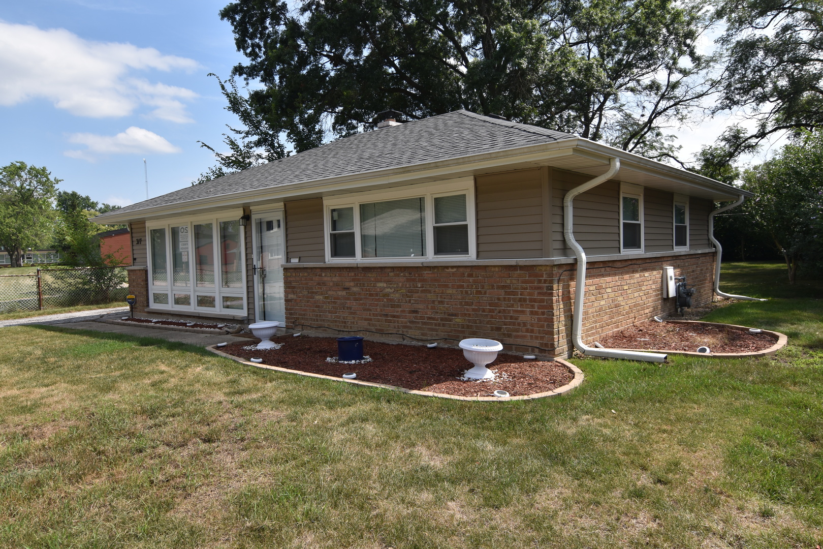 317 Mohawk Street Park Forest, IL 60466 - Photo 2 of 20 a view of a house with a yard and sitting area