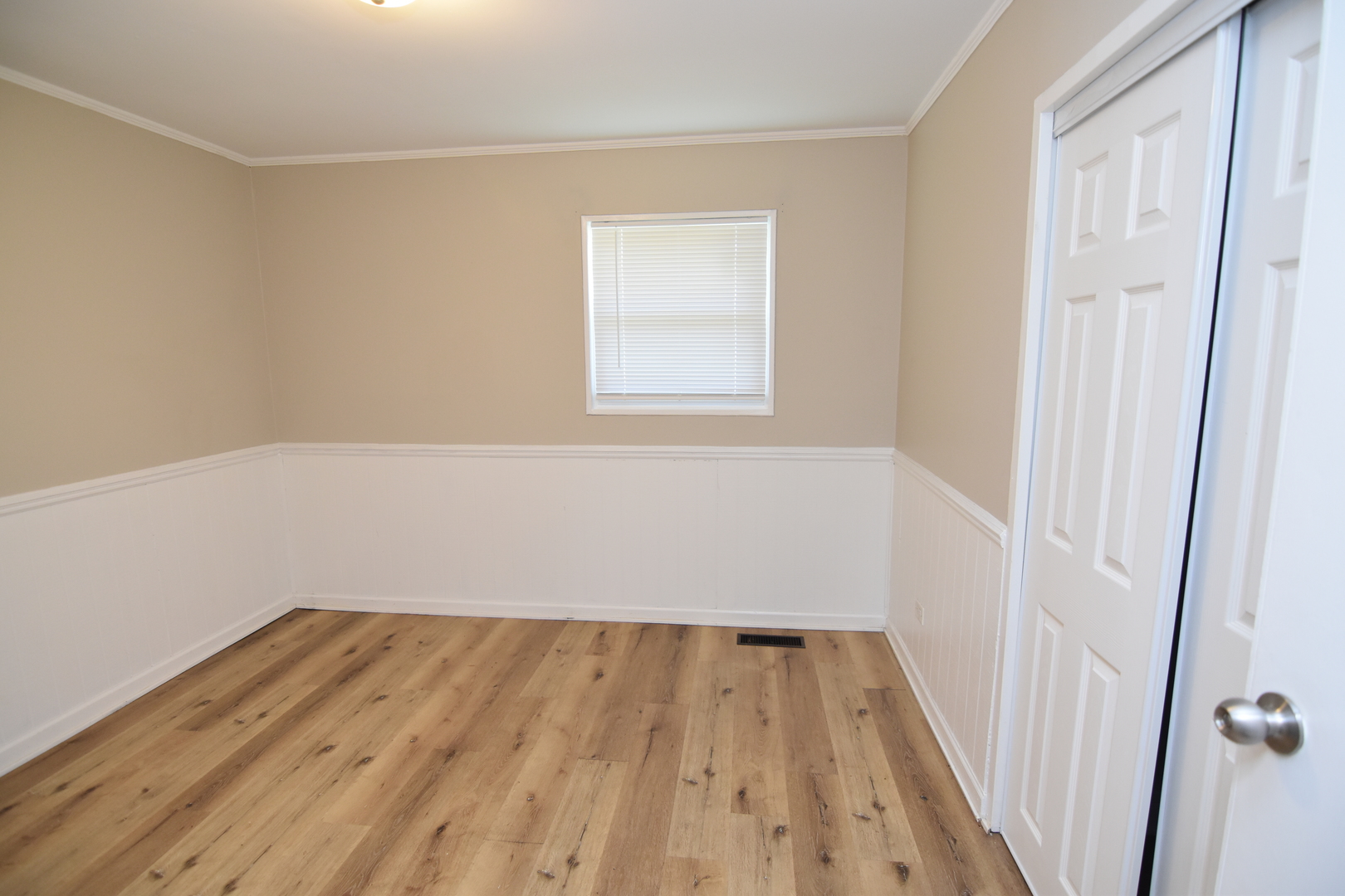 317 Mohawk Street Park Forest, IL 60466 - Photo 8 of 20 a view of a small space with wooden floor and a window