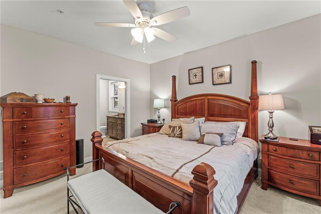 104 Anderson Station Venetia, PA 15367 - Photo 12 of 32 a bedroom with a bed and a chandelier