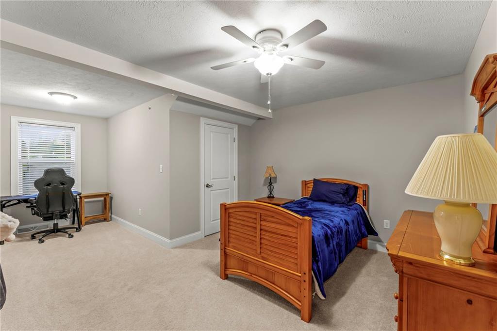 104 Anderson Station Venetia, PA 15367 - Photo 18 of 32 a bed room with a bed and a lamp