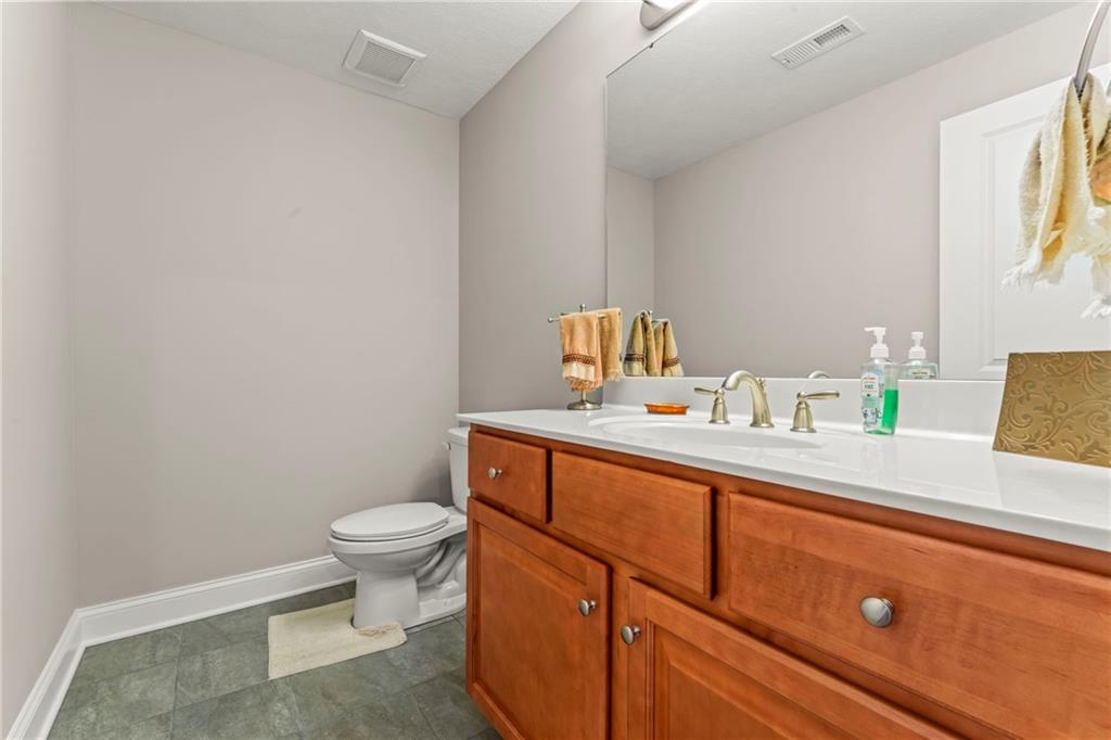 104 Anderson Station Venetia, PA 15367 - Photo 23 of 32 a bathroom with a sink a toilet and mirror