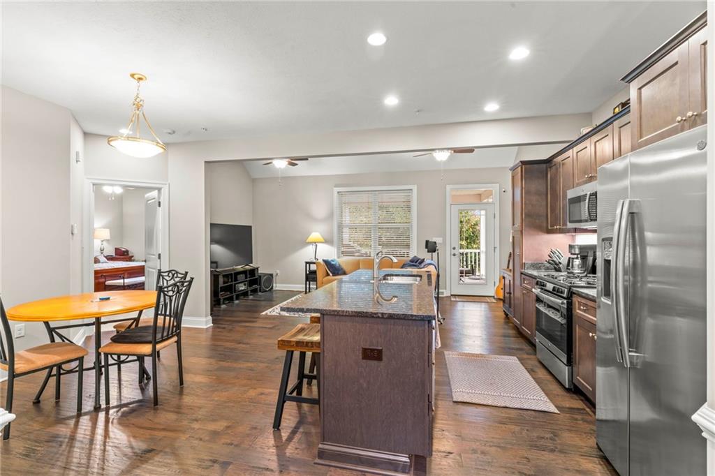 104 Anderson Station Venetia, PA 15367 - Photo 8 of 32 a very nice looking open dining room with kitchen island stainless steel appliances a table and chairs