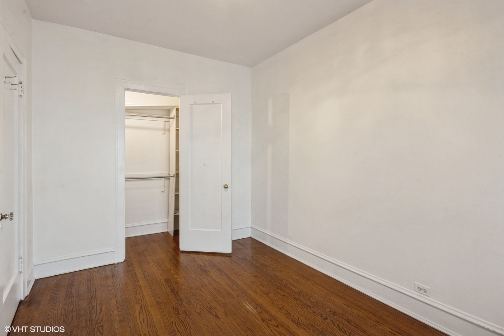 538 West Brompton Avenue, Unit 1W Chicago, IL 60657 - Photo 14 of 16 a view of an empty room with wooden floor