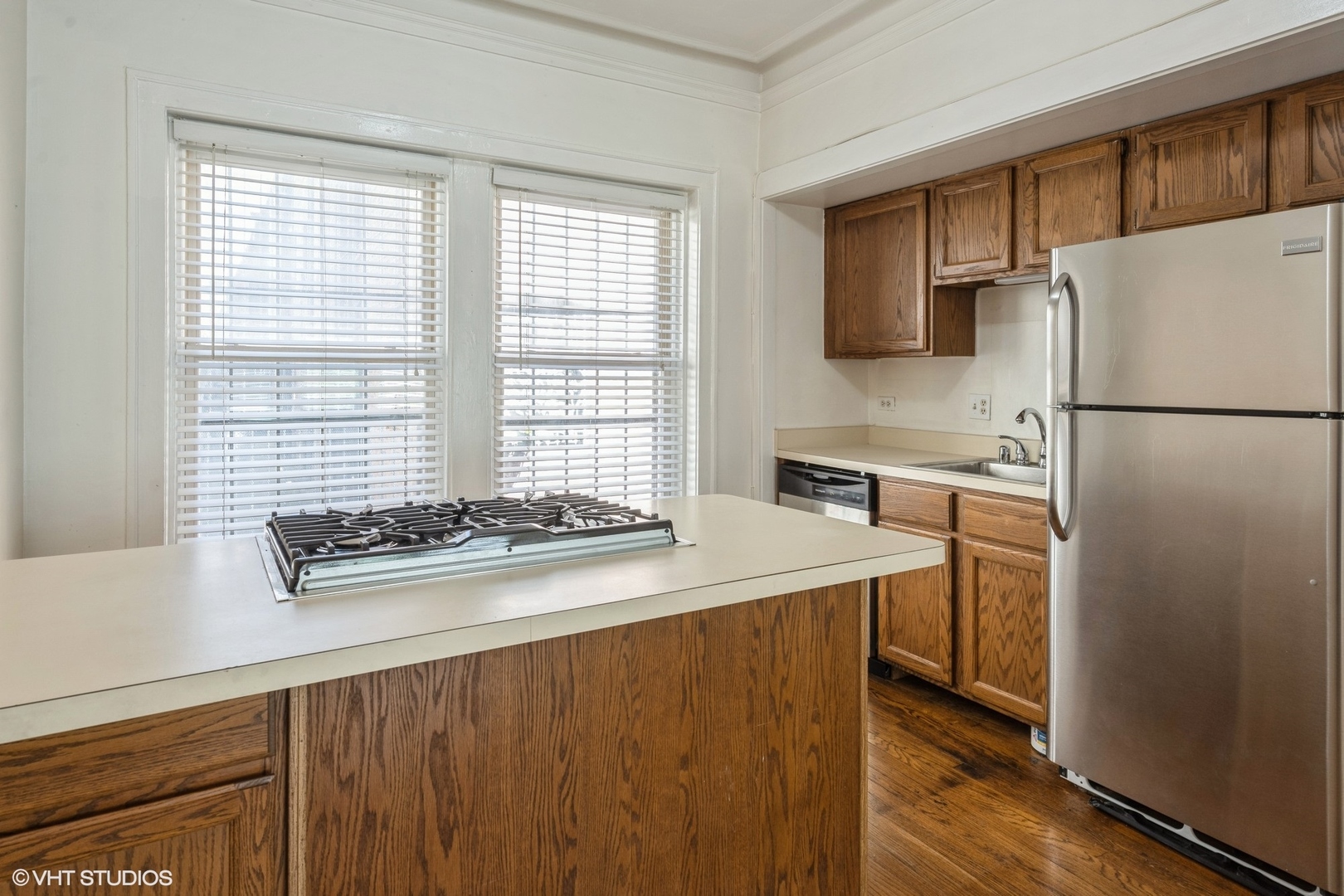 538 West Brompton Avenue, Unit 1W Chicago, IL 60657 - Photo 10 of 16 a kitchen with stainless steel appliances a refrigerator a sink and a stove