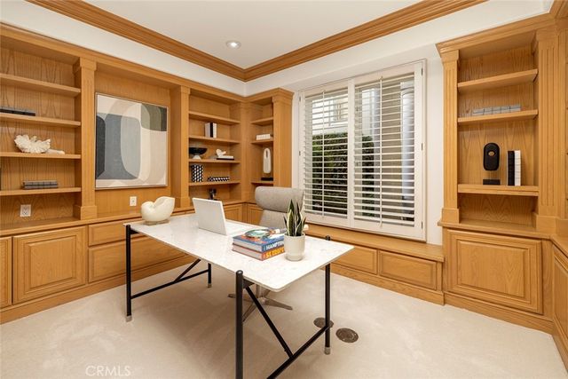 a workspace with furniture and window