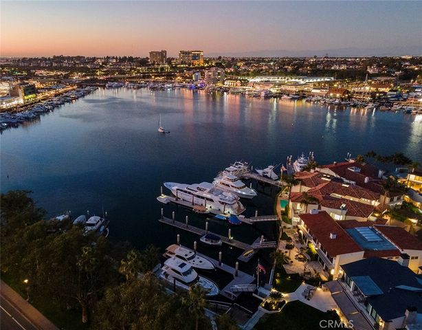 a view of a lake with lawn chairs