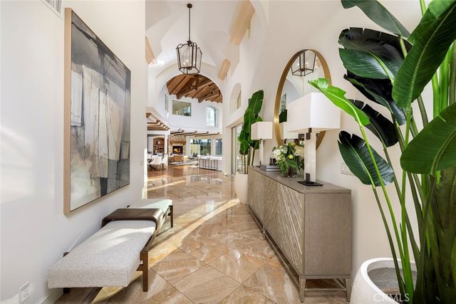 a view of a living room and entryway