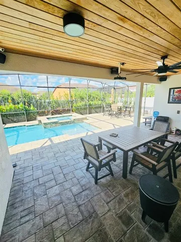 a backyard of a house with outdoor seating