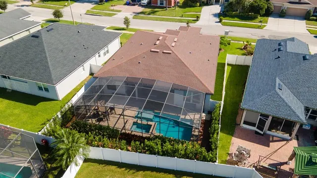 an aerial view of a house with a swimming pool