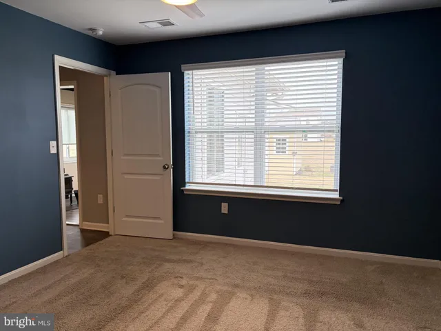 a view of a room with a hanging light