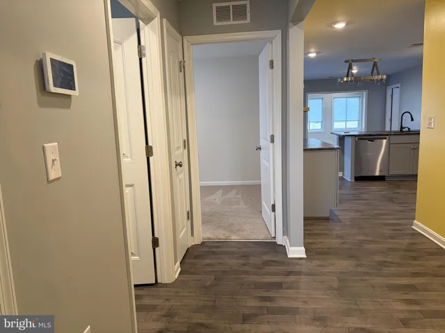 a view of a kitchen from the hallway