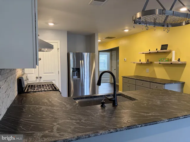 a view of a swimming pool and a chandelier