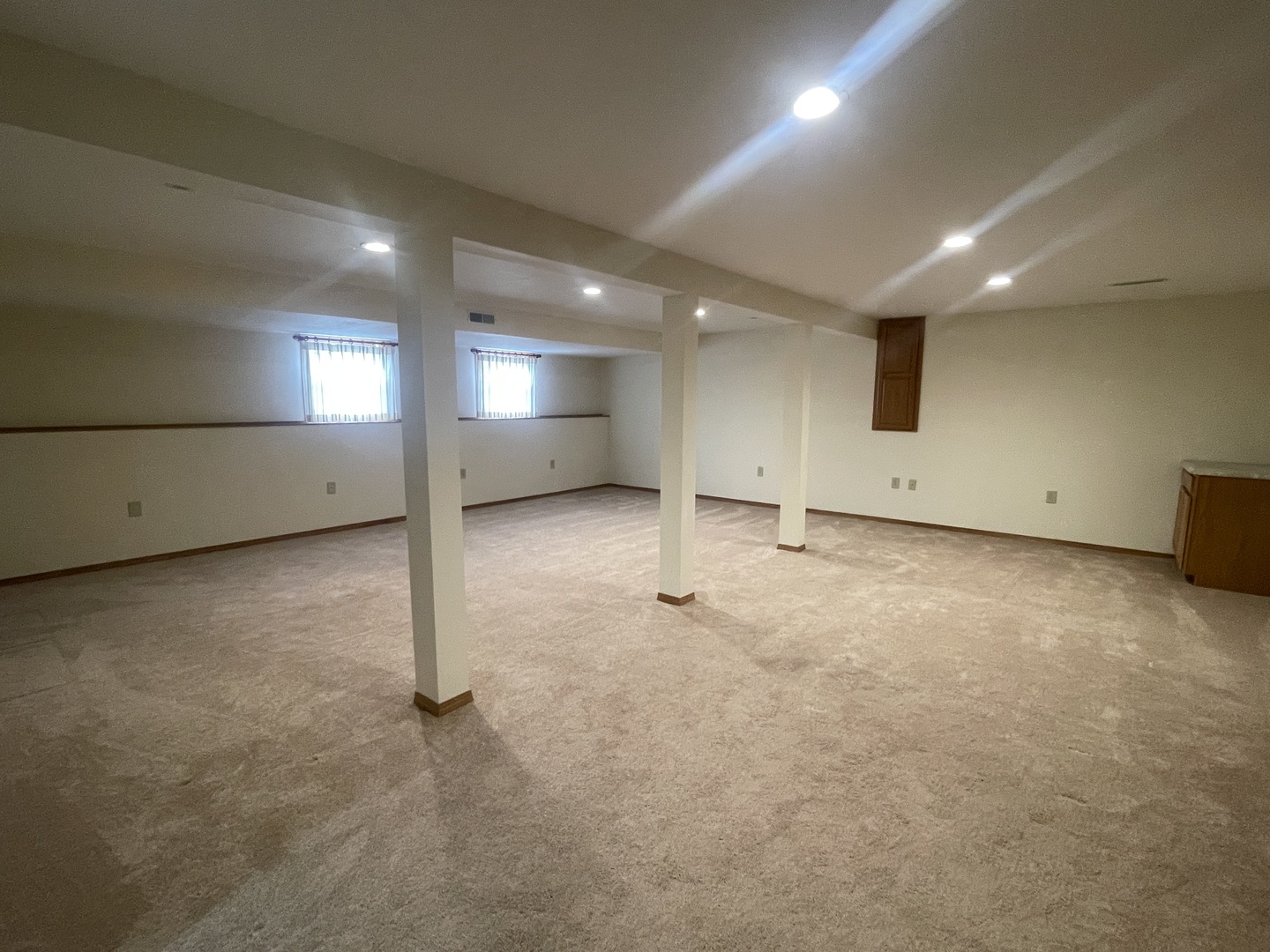 205 Field Court Normal, IL 61761 - Photo 10 of 22 an empty room with a projector and white walls