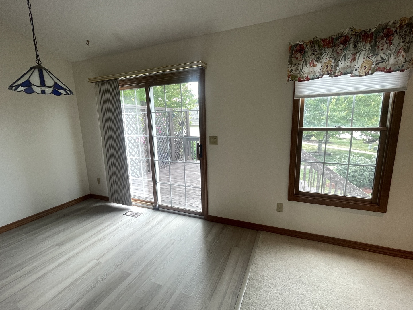 205 Field Court Normal, IL 61761 - Photo 4 of 22 an empty room with wooden floor and windows