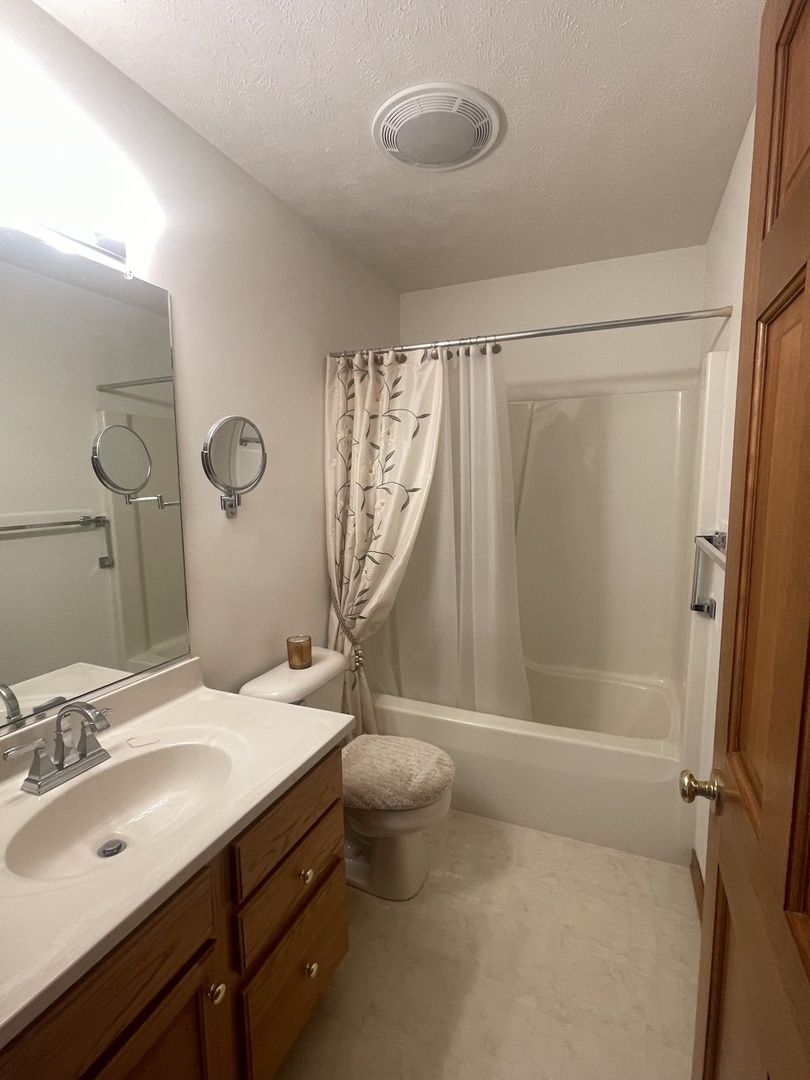 205 Field Court Normal, IL 61761 - Photo 8 of 22 a bathroom with a sink toilet and shower