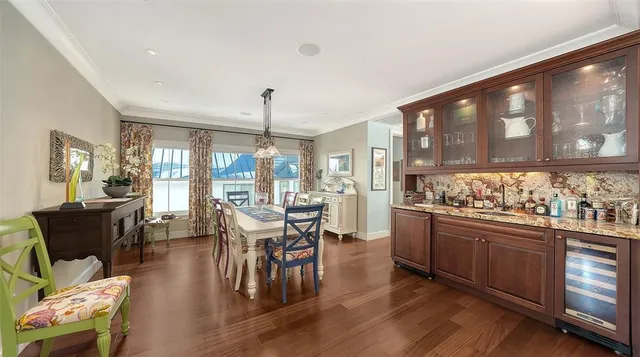 a spacious bathroom with a granite countertop sink mirror and bathtub