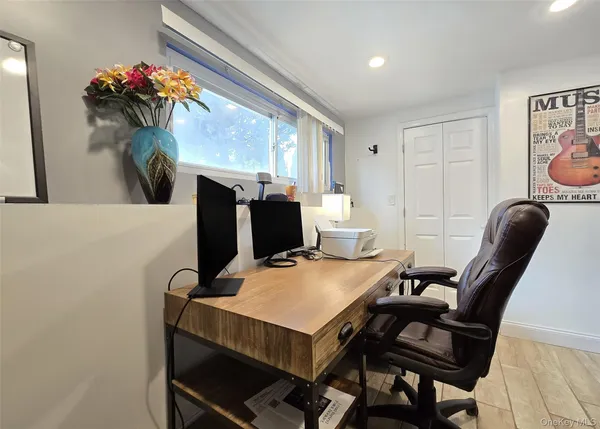 a view of a workspace with furniture and a couch