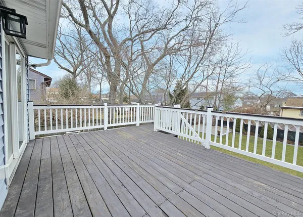 a view of deck with wooden floor and fence