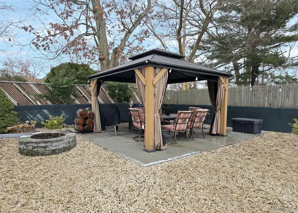 a view of a chairs and table in the patio