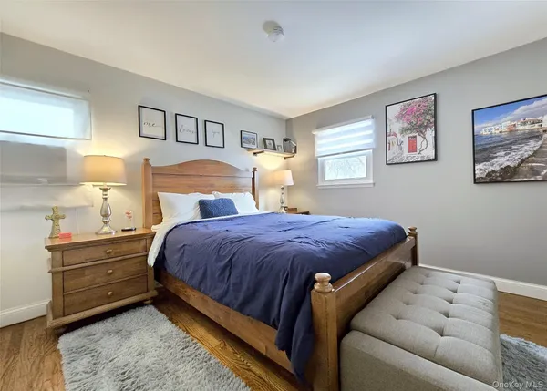 a bed room with a bed and a night stand