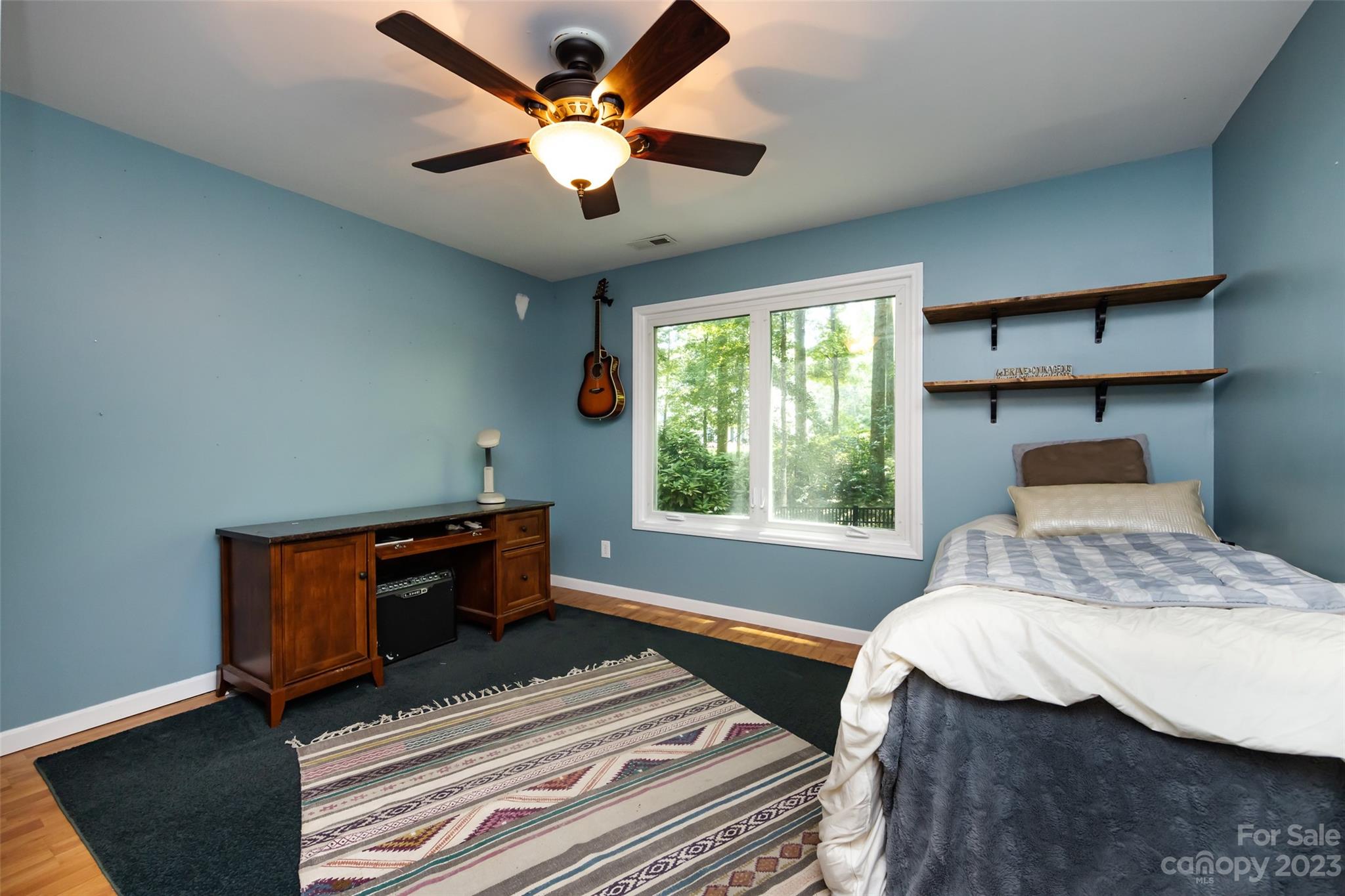 9441 Man O War Road Indian Land, SC 29707 - Photo 16 of 45 a bedroom with a bed and a chandelier