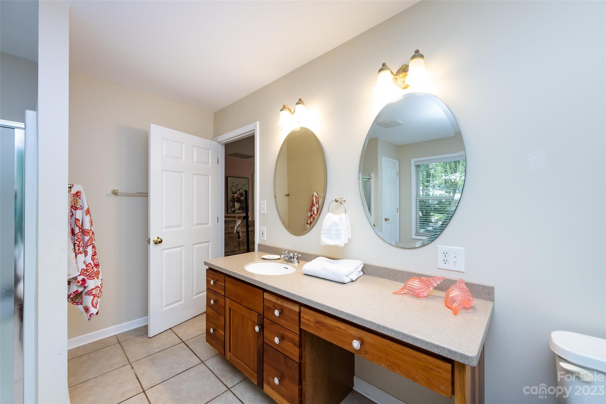 9441 Man O War Road Indian Land, SC 29707 - Photo 28 of 45 a bathroom with a toilet a sink and a mirror