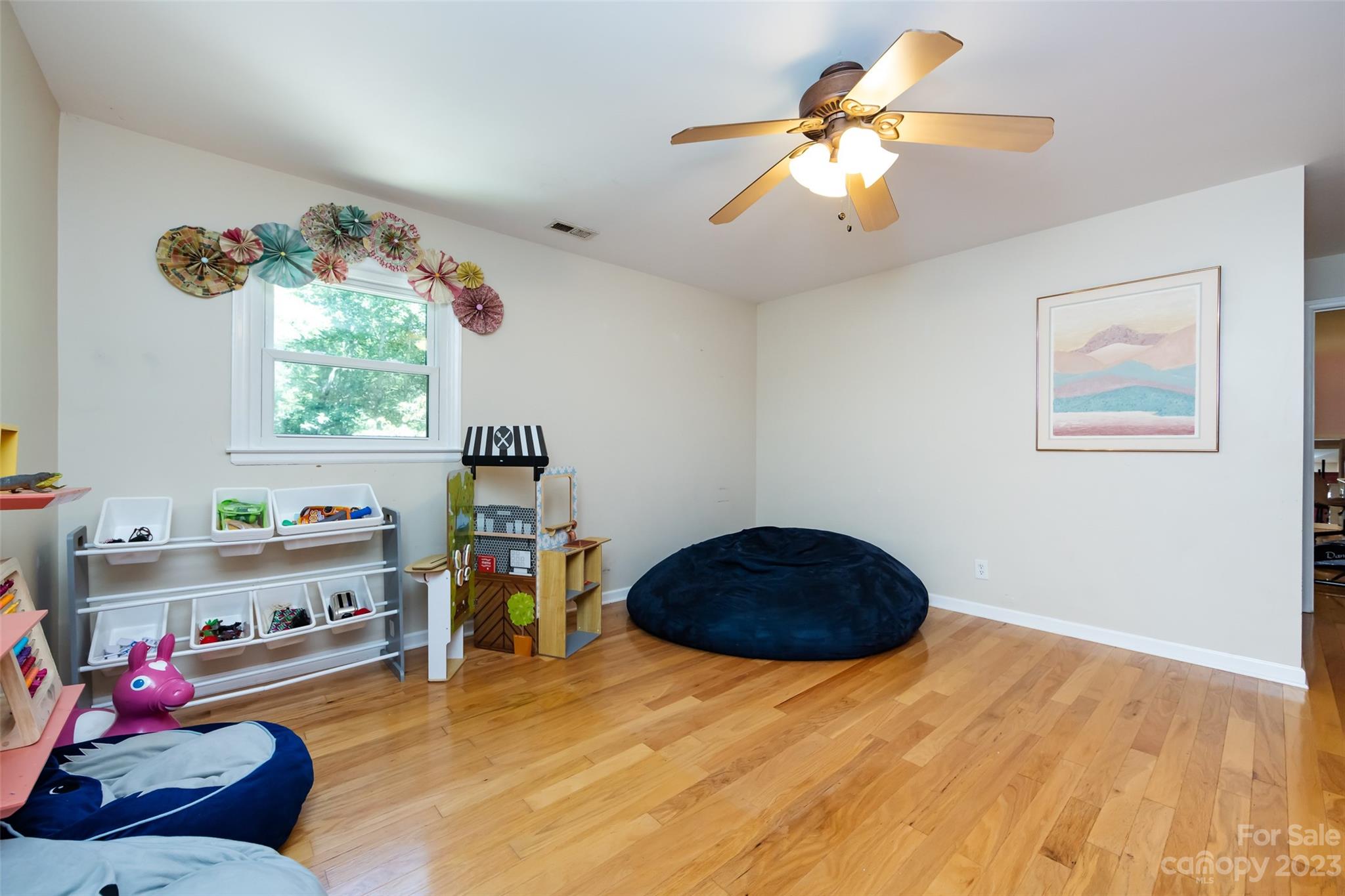 9441 Man O War Road Indian Land, SC 29707 - Photo 31 of 45 a bedroom with a bed and a chandelier