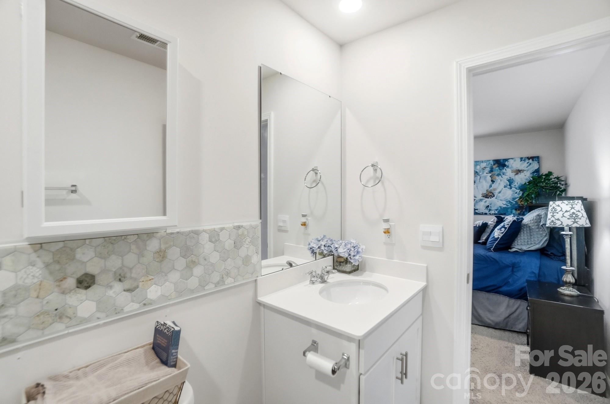 116 Timbergreen Court Troutman, NC 28166 - Photo 27 of 43 a bathroom with a sink and a mirror