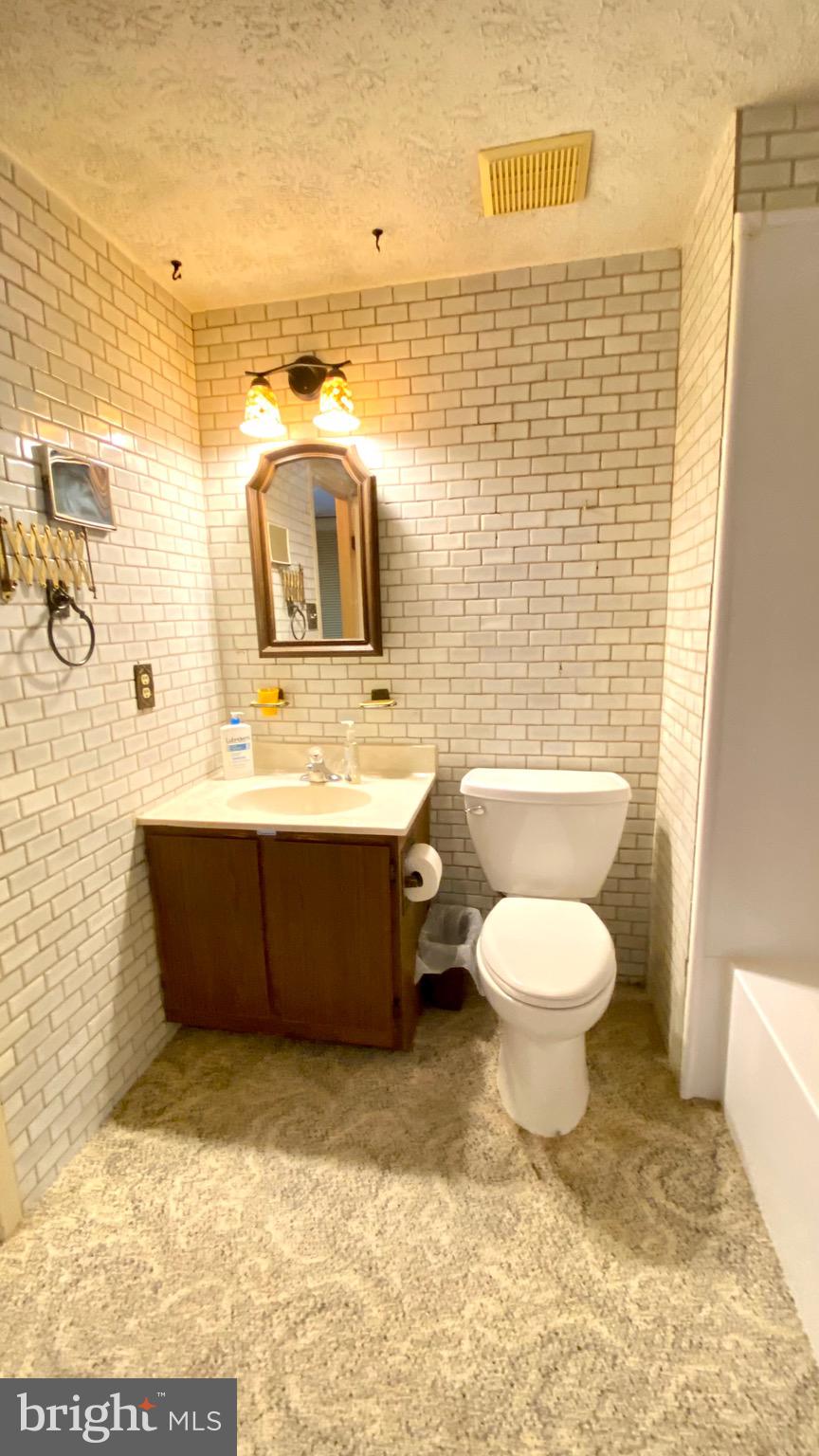 4 Old Sound Road Joppa, MD 21085 - Photo 16 of 20 a bathroom with a toilet sink and mirror