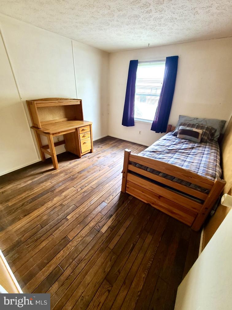 4 Old Sound Road Joppa, MD 21085 - Photo 19 of 20 a room with wooden floor and furniture