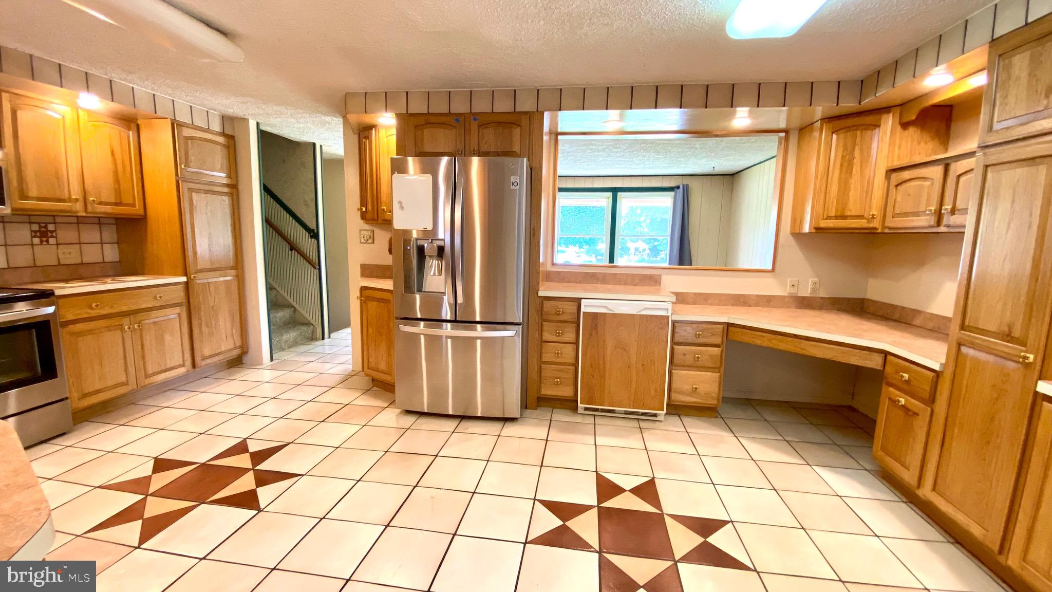 4 Old Sound Road Joppa, MD 21085 - Photo 8 of 20 a kitchen with stainless steel appliances a sink and a refrigerator