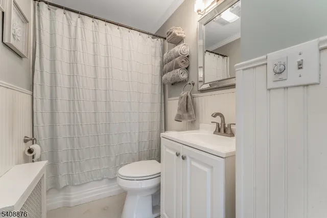 a bedroom with a bed furniture and a wooden floor