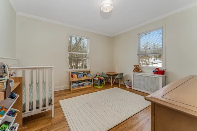 a bedroom with furniture and rug