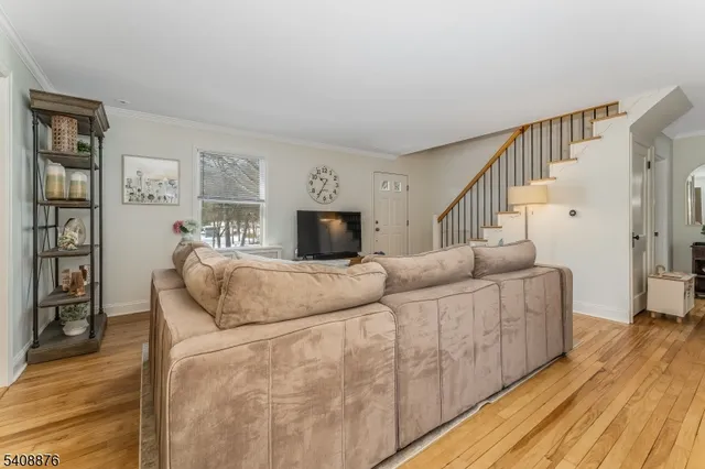 a kitchen with stainless steel appliances granite countertop a refrigerator a stove a sink and a refrigerator